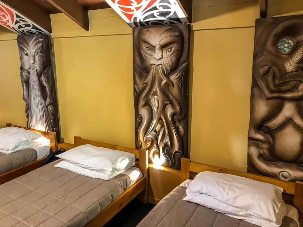 Why You Can't Miss the Tamaki Maori Village Experience in Rotorua 6 Maori gods above the beds in the sleeping house