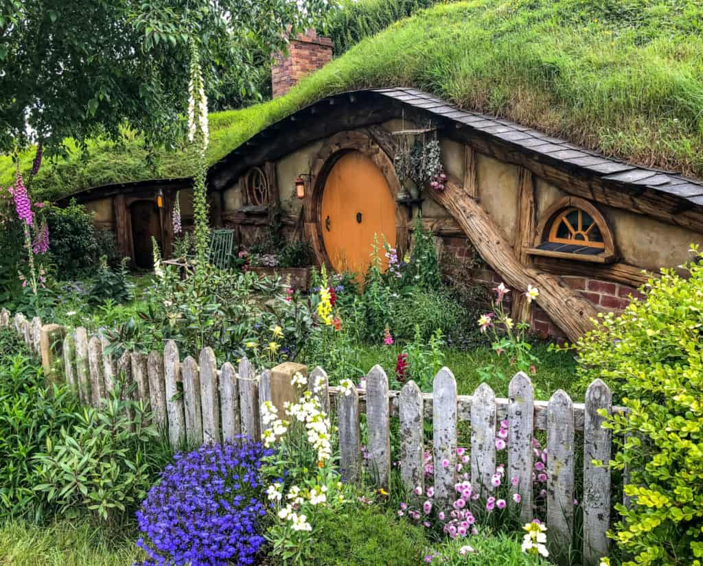 Visiting the Stunning Hobbiton Movie Set in New Zealand 18 Orange hobbit home in Hobbiton village or the Shire in New Zealand.