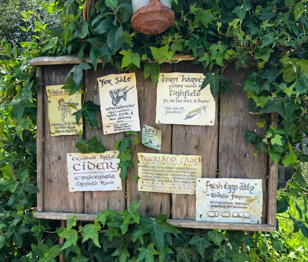 Visiting the Stunning Hobbiton Movie Set in New Zealand 6 Fake sign board at the Hobbiton movie set in New Zealand listing want ads, for sale signs, and job postings