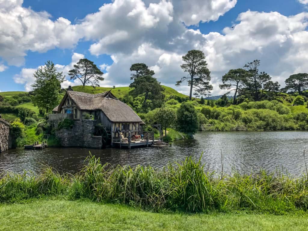 Visiting the Stunning Hobbiton Movie Set in New Zealand 9 Hobbiton movie set in New Zealand's Green Dragon Inn: an old world stone pub set aside the green fields around a clear blue pond