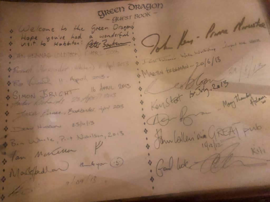 Visiting the Stunning Hobbiton Movie Set in New Zealand 10 Green Dragon Inn guest book image with Sir Ian McKellan's signature among others from the Hobbit movies.