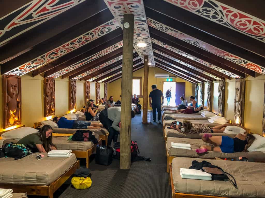 135 New Zealand Slang: From Sweet As to Swear Words 8 A group of people are sleeping in a Maori village.