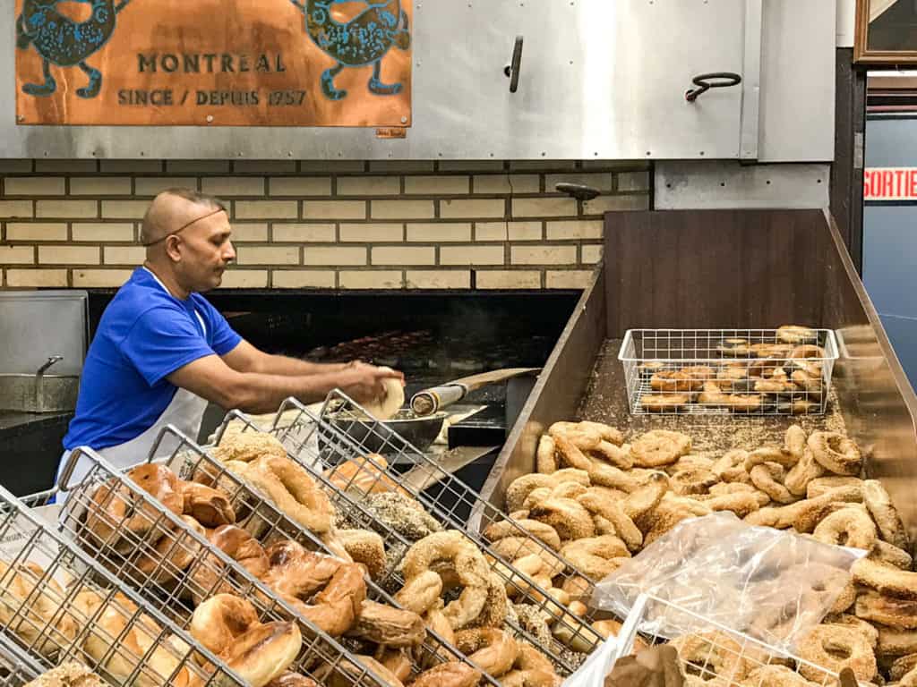 Canada Cuisine to Try: Traditional Food Canada is Famous For 10 Man making Montreal style bagels