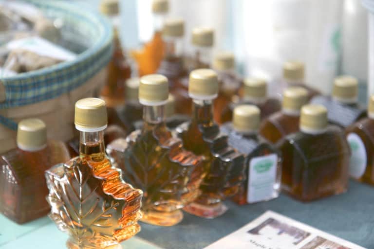 A display of maple syrup bottles, showcasing the richness of Canada's cuisine.