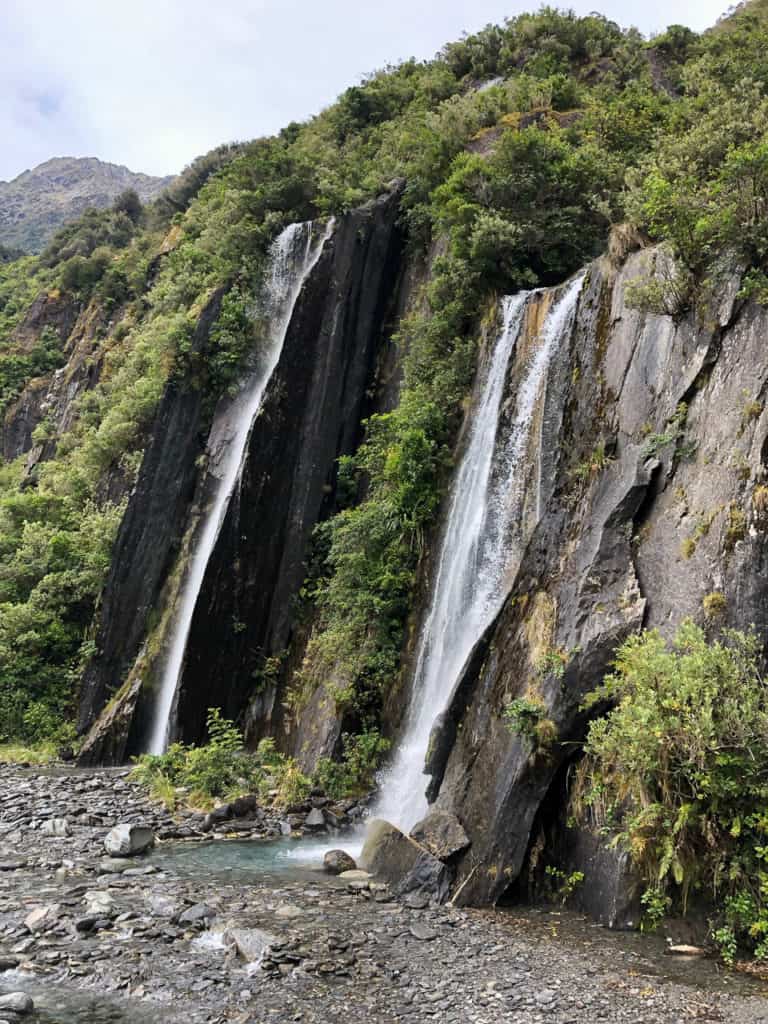 Franz Joseph Glacier Walk: The Cheapest Way to See the Franz Josef Glacier in New Zealand 3 Franz Josef Glacier Valley waterfalls where you can get glacier water.