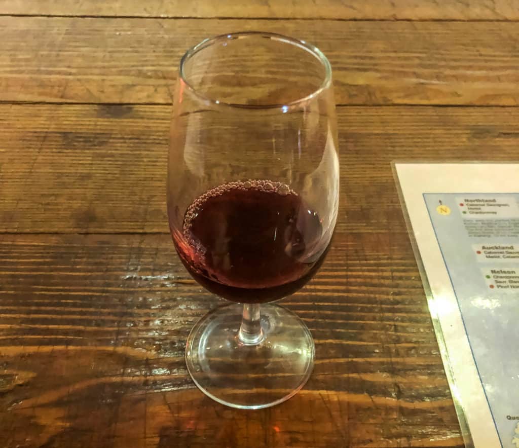 When is winter in New Zealand? (& Should You Visit?) 12 Red wine in a tasting glass in Hawkes Bay, New Zealand