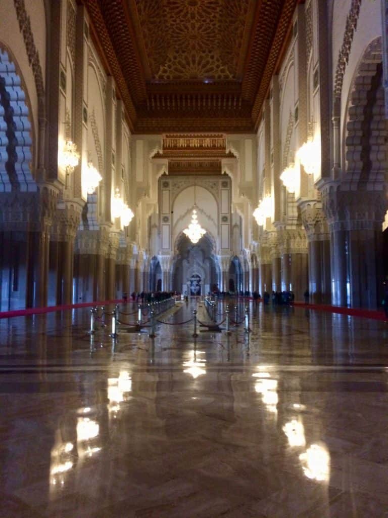 The Unbelievable Location That Made a Travel Pro Say 'Never Again!' 4 Inside the mosque in Casablanca. Blurry photo of the large columns and the rounded archways.