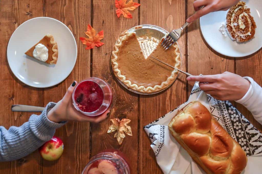 Canadian vs American Thanksgiving: What's the Difference? 6 Pumpkin pie being shared at a Canadian thanksgiving