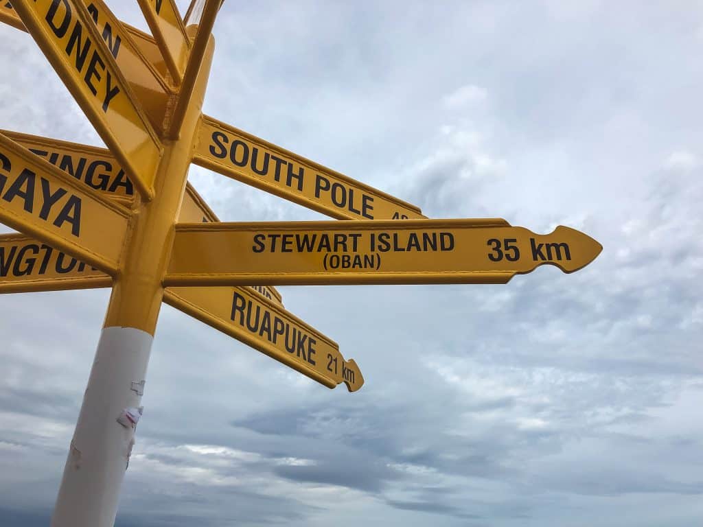 18 Best Things to Do In South Island of New Zealand 2024 18 Direction sign pointing to Stewart Island