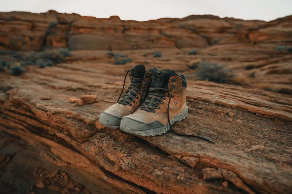 57 New Zealand Travel Tips (2024 Local's Guide) 1 Hiking boots on a log
