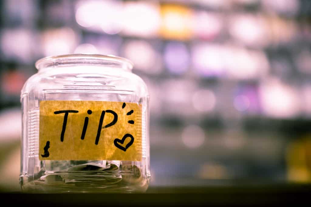 57 New Zealand Travel Tips (2024 Local's Guide) 6 Tip jar on a New Zealand bar counter