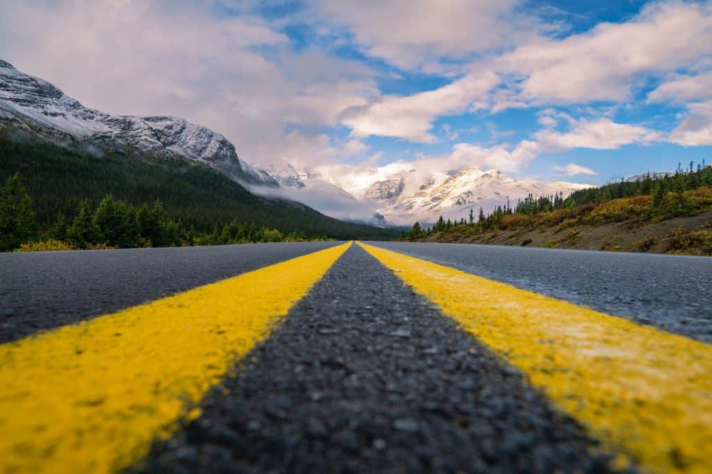 83 Bucket List Canada Things to Do in 2025 from a Canadian 29 Upclose view of the road driving north on the Icefields Parkway.