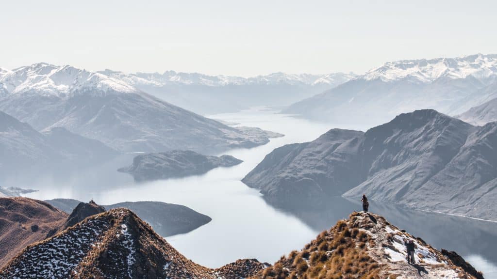 25 Pros and Cons of Living in New Zealand 12 People summitting Ben Nevis in New Zealand during winter