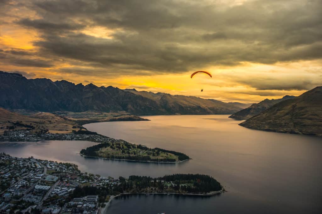 Car Rental in Queenstown: Everything You Need to Know (2024) 1 Man paragliding over Queenstown and Lake Wakaitipu from viewpoint at Queenstown Skyline, New Zealand