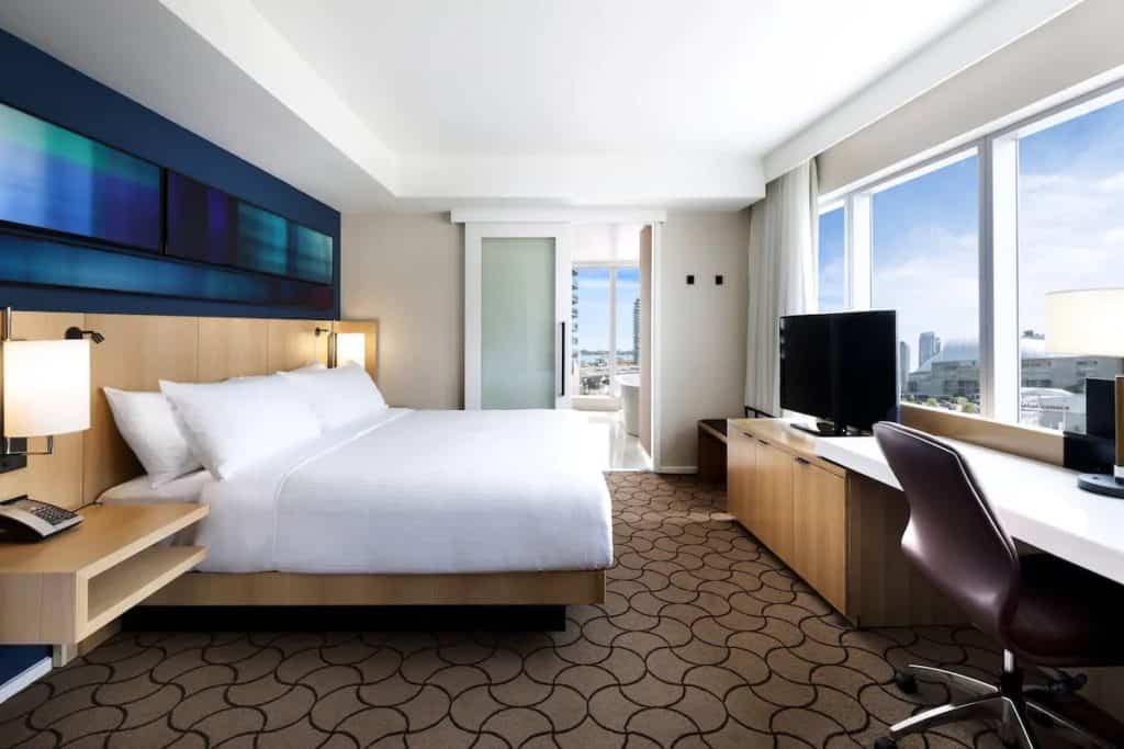 15 Best Hotels in Toronto with Private Hot Tubs (2024) 4 Private jacuzzi in room in the Delta Hotel with a view from the bedroom into the jacuzzi ensuite in the bathroom