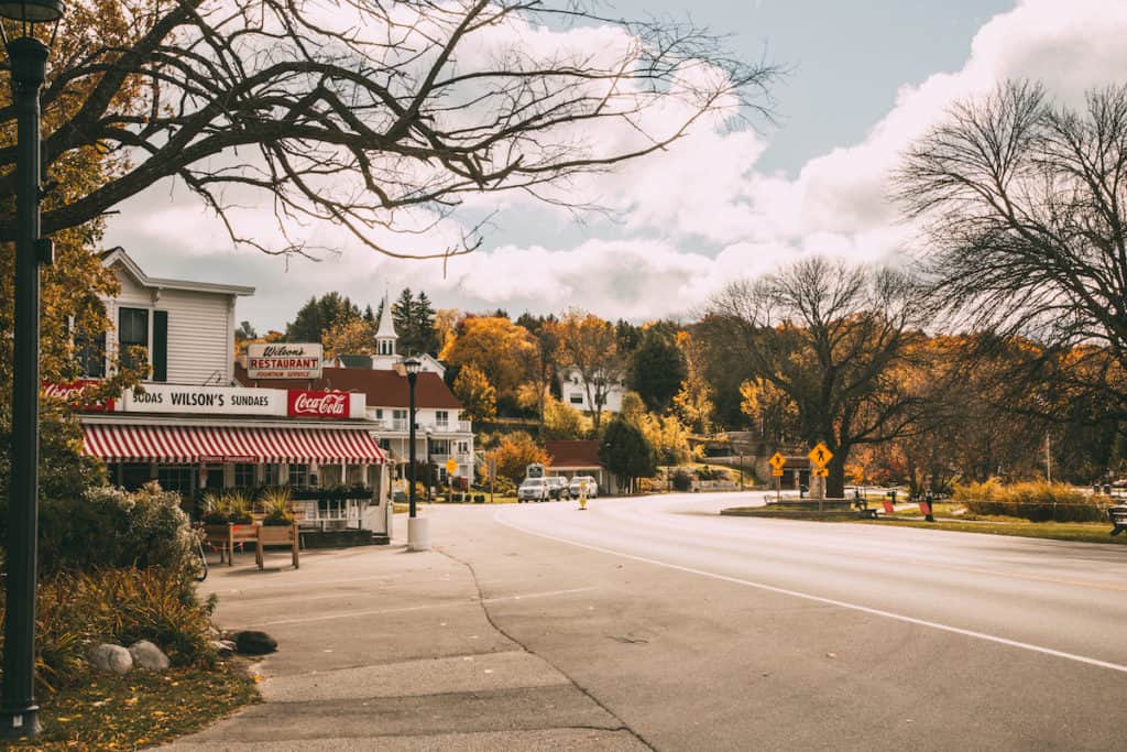 27 Best Weekend Getaways in the US 4 Door County Wisconsin main street with autumn leaves