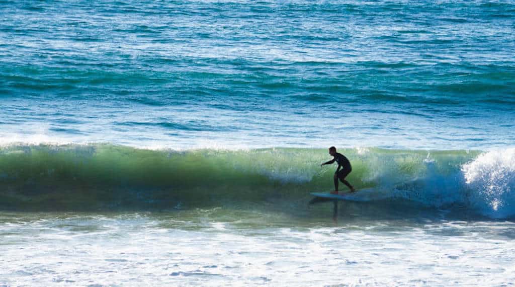 27 Best Weekend Getaways in the US 21 surfer on the beach of San Diego