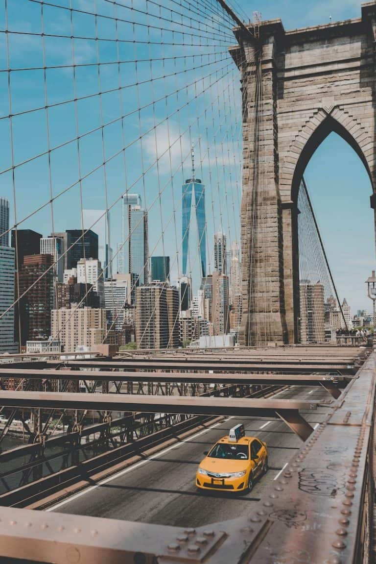 27 Best Weekend Getaways in the US 3 New york City view from the Brooklyn Bridge and a yellow cab