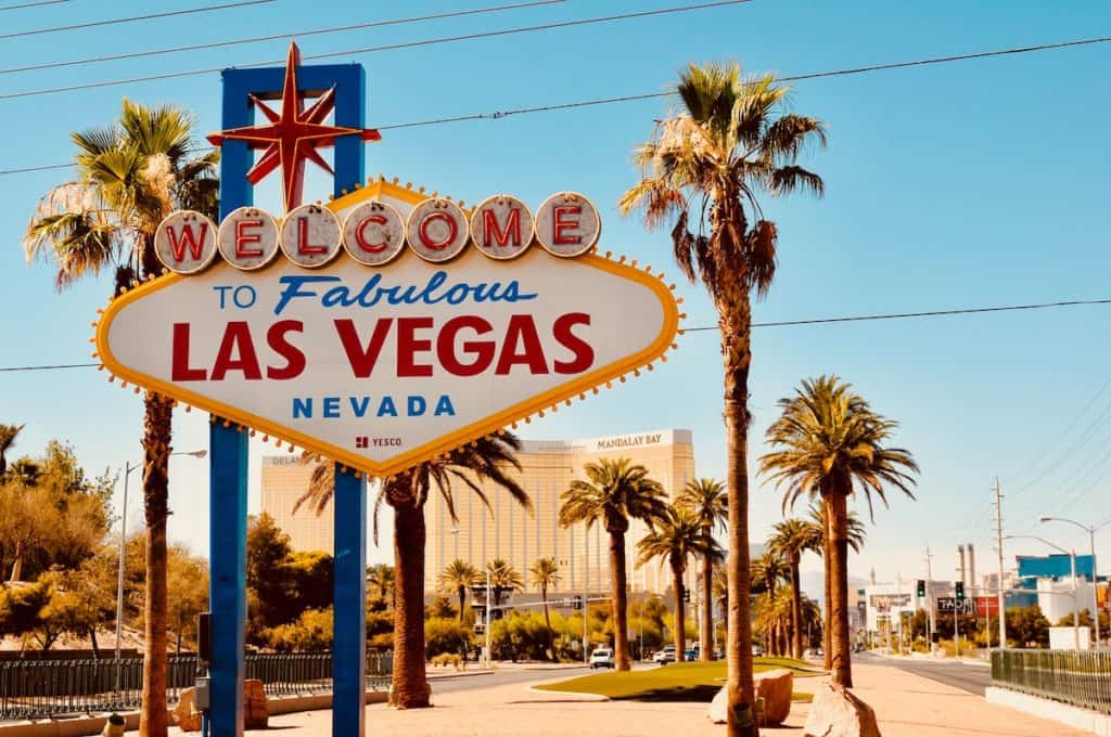 27 Best Weekend Getaways in the US 25 Sign that says "Welcome to Las Vegas" among palm trees