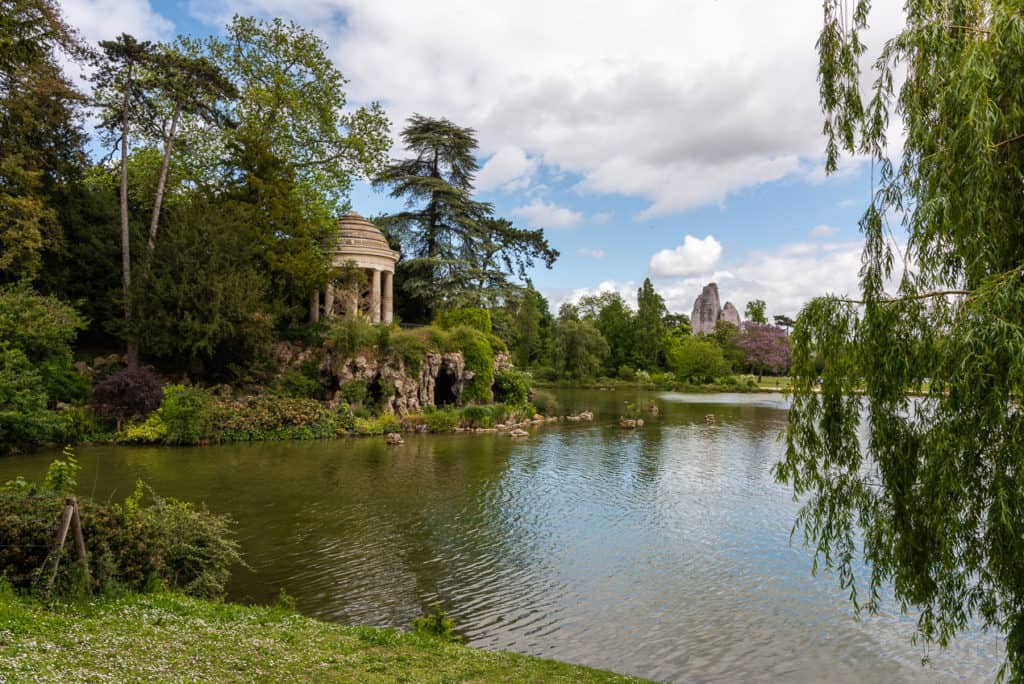 23 Pros and Cons of Living in France in 2024 1 A pond surrounded by trees and a gazebo at the Beautiful Gardens of Bois de Vincennes in Paris