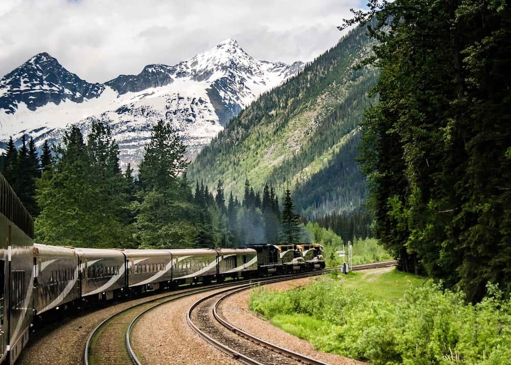 83 Bucket List Canada Things to Do in 2025 from a Canadian 22 Rocky Mountaineer train going through the forest in Canada.