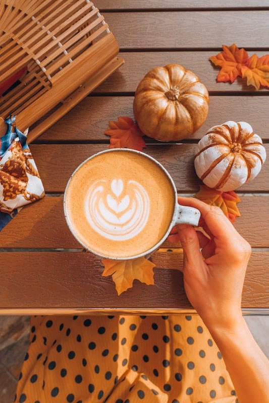 160 Best Fall Quotes and Captions for Instagram 2024 4 Pumpkin spice latte flat lay for fall