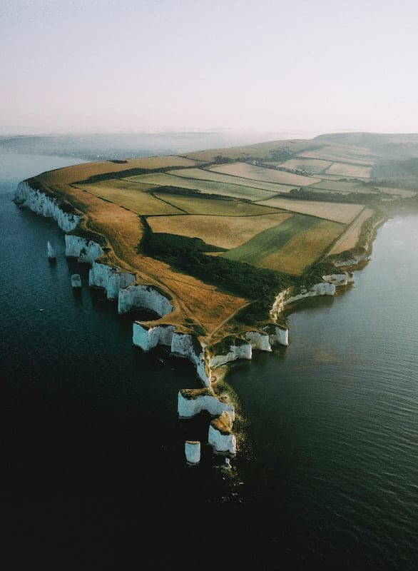 35 Pros and Cons of Living in the UK in 2024 9 The stunning landscape of the Jurassic Coast is a pro of living in England