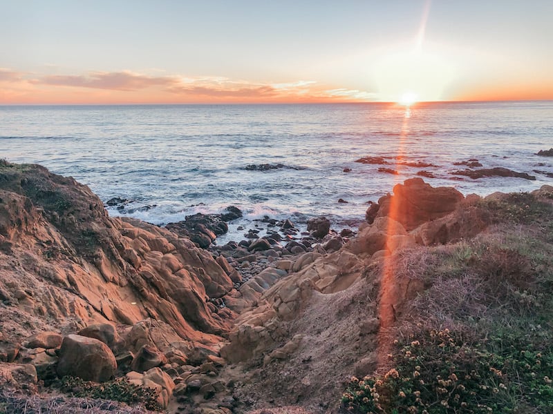 20 Most Beautiful States in the USA in 2024 20 California coast with jagged rocks on the setting sun