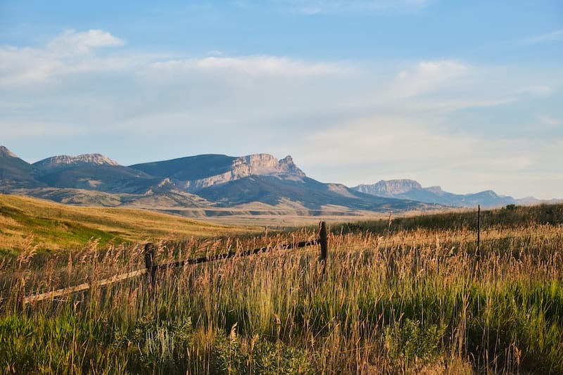 20 Most Beautiful States in the USA in 2024 14 Plain fields of Montana with mountains in the back from Unsplash