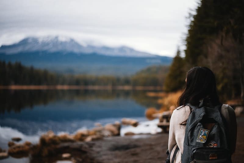 20 Most Beautiful States in the USA in 2024 5 Unsplash image of woman in front of pretty Mount Hood in Oregon state