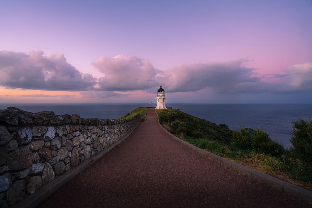 7 Best Things to Do at Cape Reinga, New Zealand 2024 5 Sunset over the Cape Reinga ligthhouse