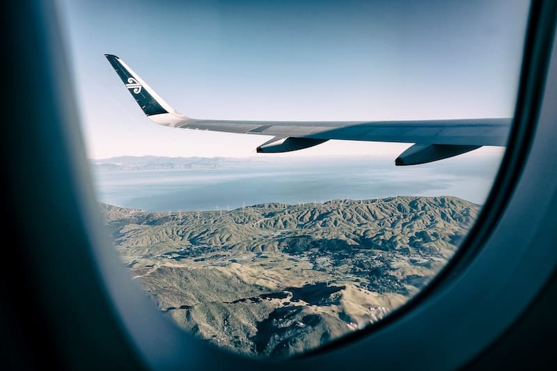 57 New Zealand Travel Tips (2024 Local's Guide) 8 View out the window of an airplane over New Zealand
