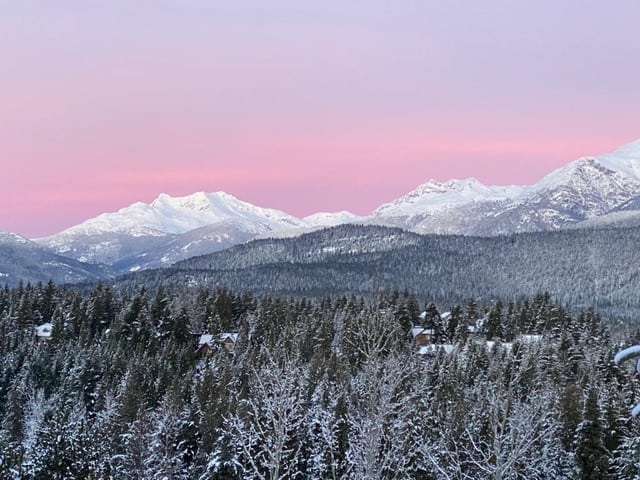 These are the Best Outdoor Adventures Near the US/Canada Border 3 Whistler Blackcomb views over the snowy valley and ski mountain.