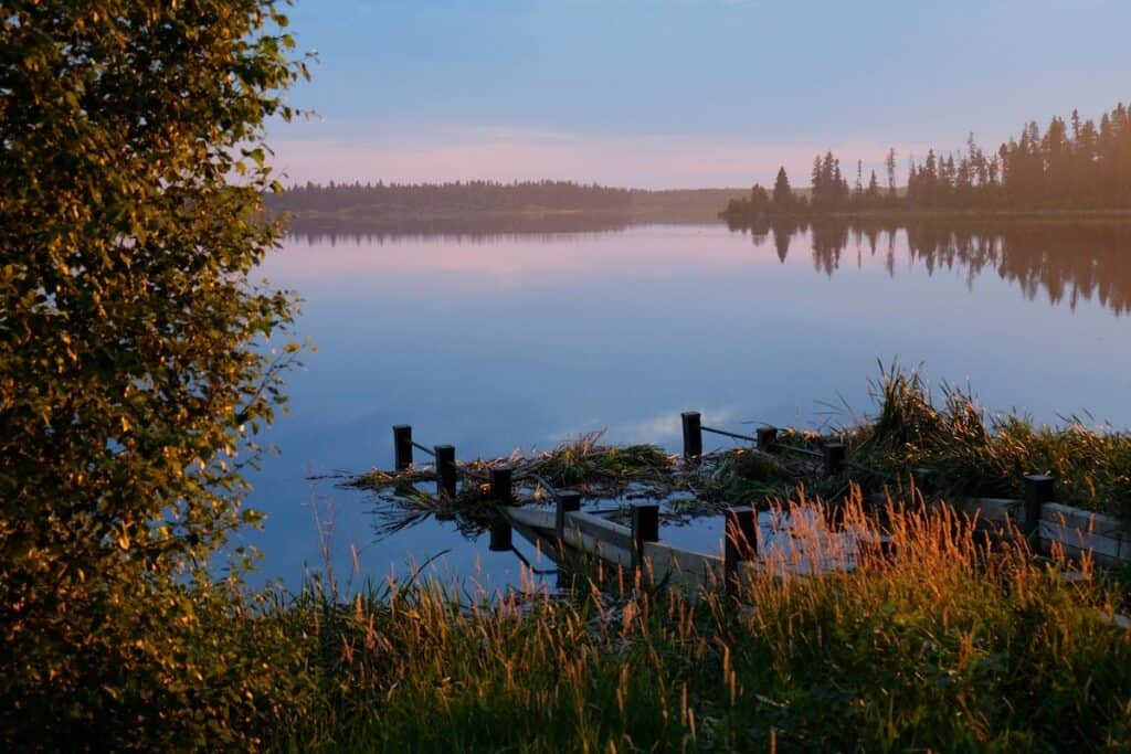 Canada in Autumn: 15 Reasons to Visit + Weather Guide 19 Elk Island National park in fall at sunset over lake