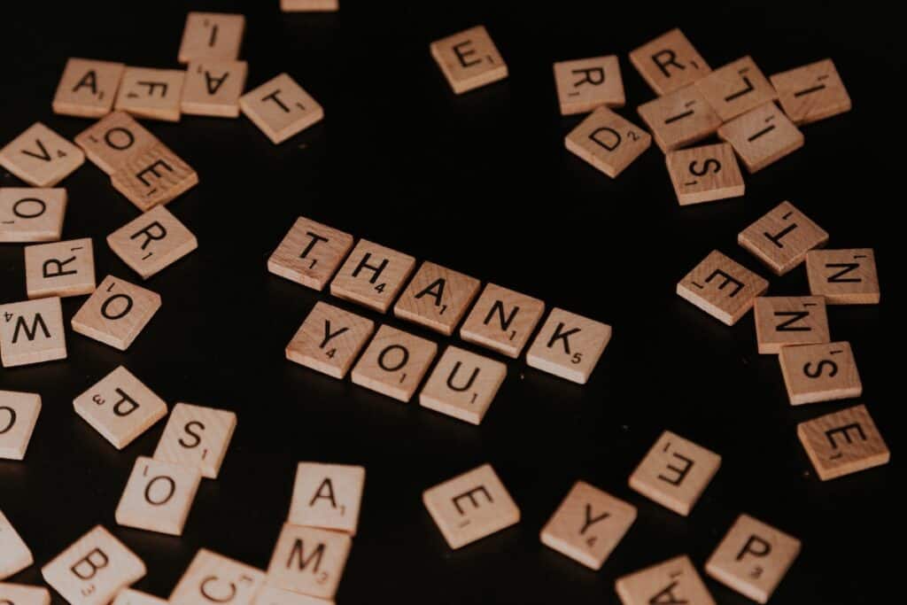 How to Say Thank You in 100 Different Languages 9 "Thank You" in scrabble tiles surrounded by other tiles.