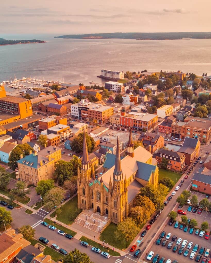 15 Best Cities to Live in Canada in 2024 (Local Tips!) 9 Charlottetown city centre with views of the large church and the heritage buildings surrounded by trees. Charlottetown is one of the best places to live in Canada for retirees.