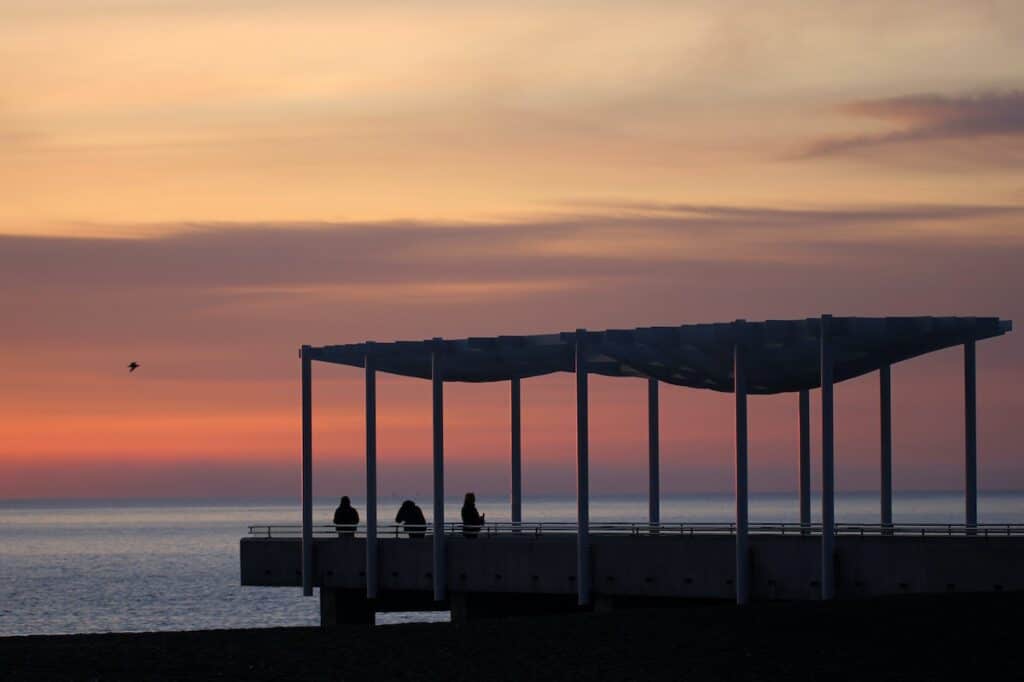 13 Best Places to Live in New Zealand (and Where Not To!) 7 Sunset view over the pier from Napier. A great way to enjoy living in New Zealand.