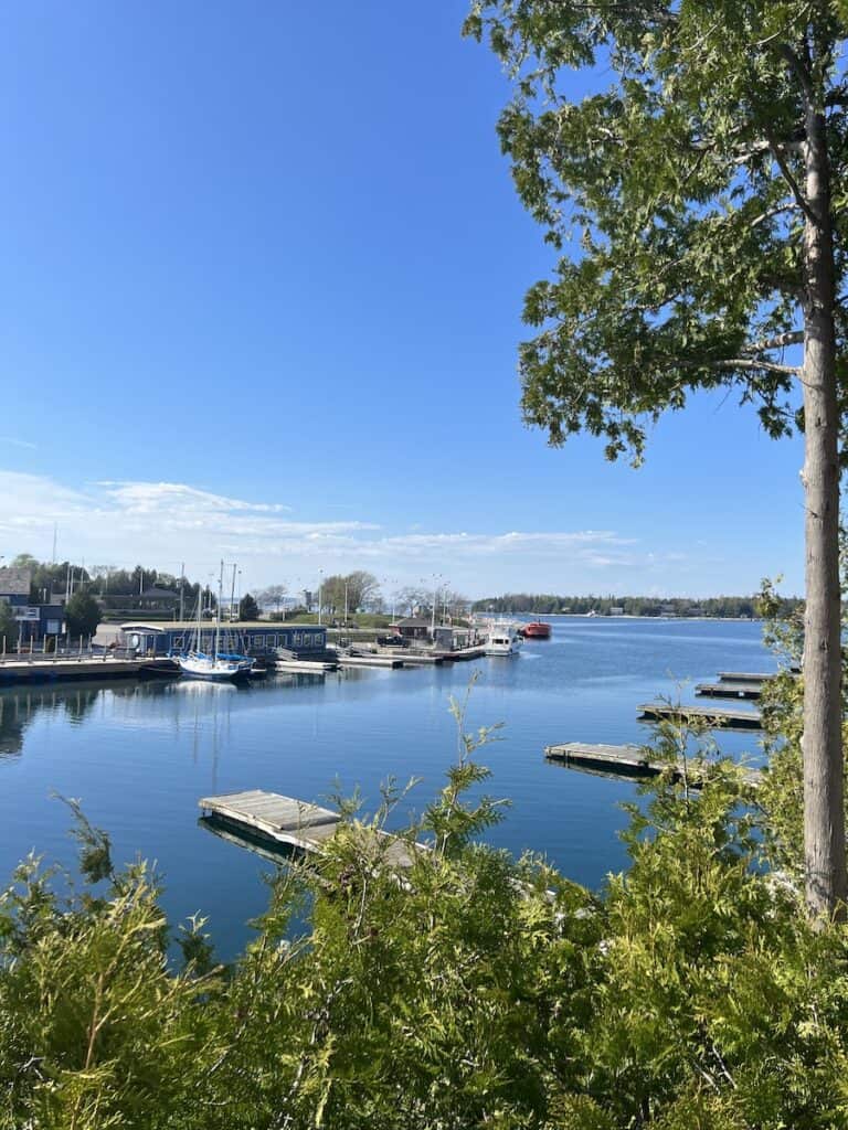 25 Jaw-Dropping Things to Do Tobermory, Ontario 6 Little Tub Harbour in Tobermory. Docks with sailboats lined up.