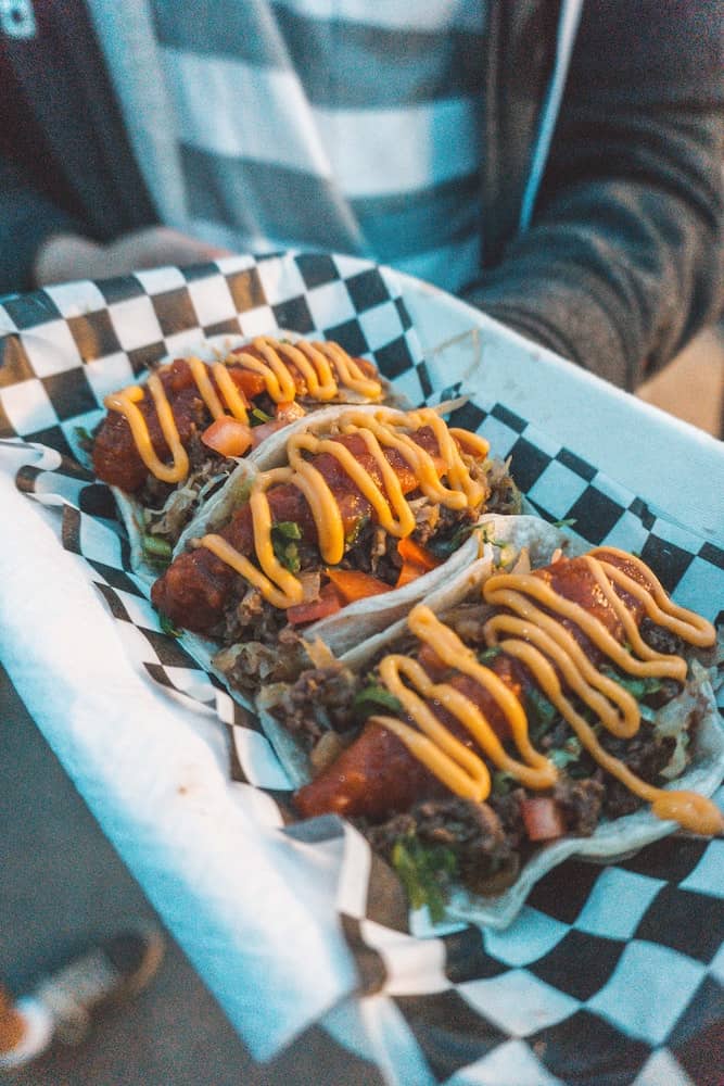 37 Amazing Vancouver Bucket List Things to Do 10 Crispy fish tacos on a plate from the Richmond Night Market in Vancouver.