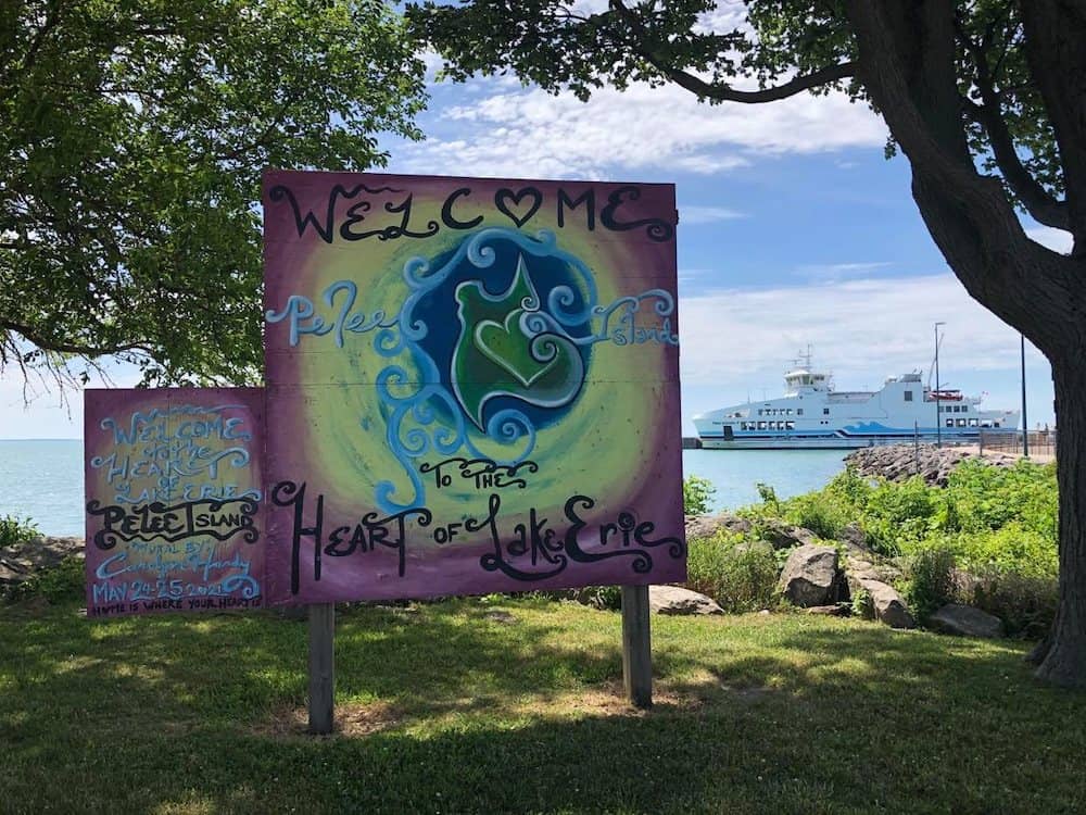 Michigan to Canada Drive: Best Places to Stop in Canada 4 Colourful sign saying "Welcome to Pelee Island" in Canada.