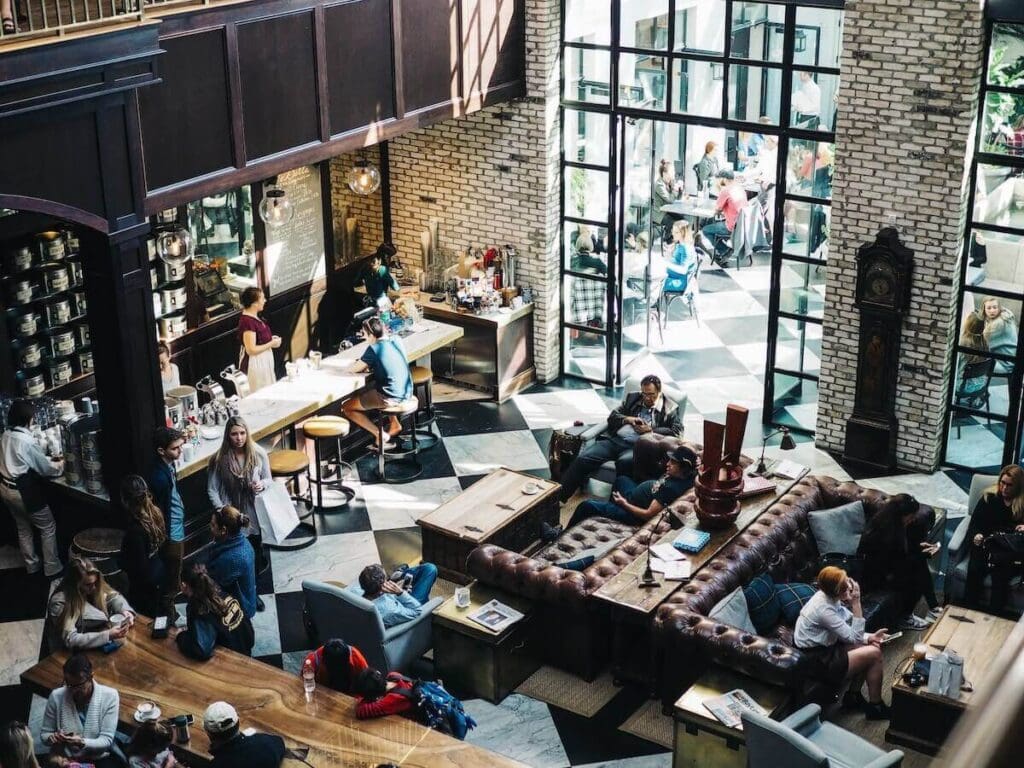 23 Pros and Cons of Living in Nashville in 2024 3 A big coffee bar in Nashville filled with people hanging out and relaxing. A busy day indeed!