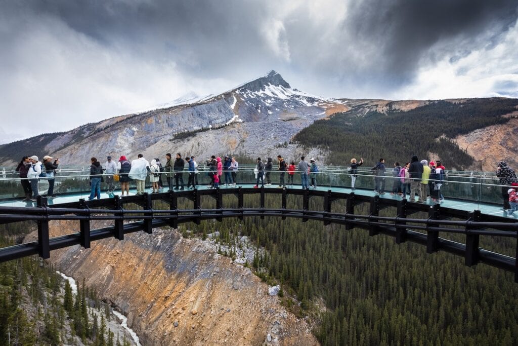 Banff National Park Itinerary: 1, 3, and 5 Day Guides 21 The incredible scenery of the Columbia Skywalk with lots of tourists enjoying the view of the mountain.