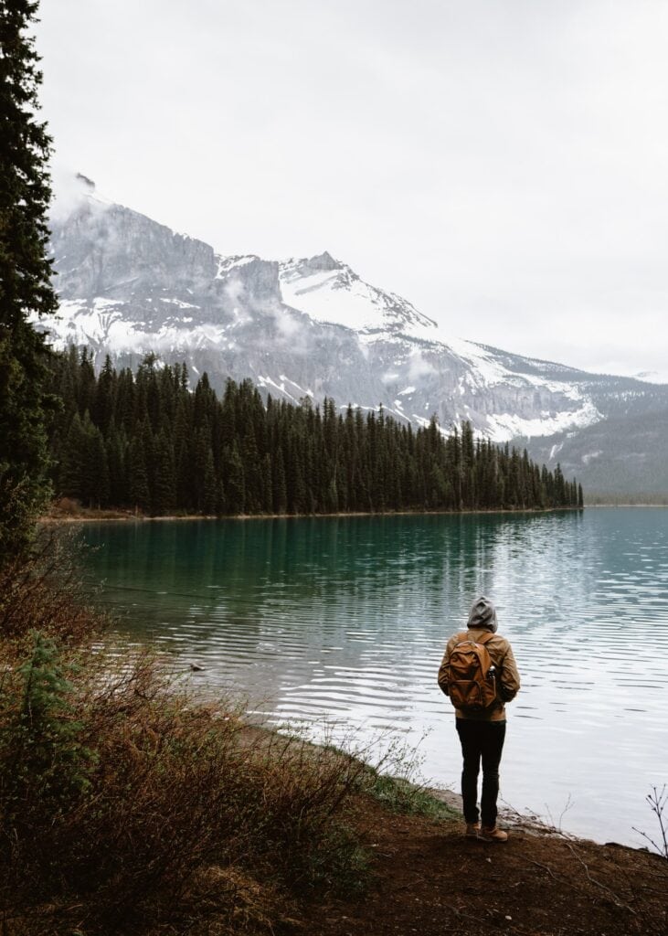 Where to Stay in Lake Louise Canada: 14 Best Hotels (2024) 12 A person standing Beside Emerald Lake