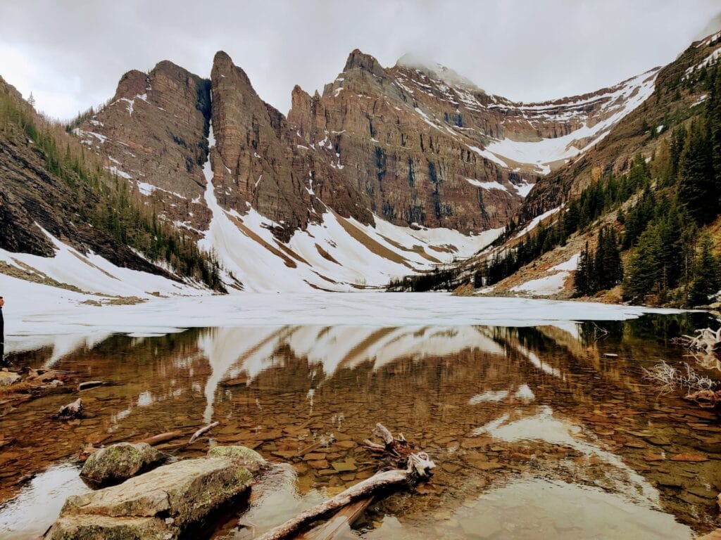 Where to Stay in Lake Louise Canada: 14 Best Hotels (2024) 2 A river running through a snowy mountain