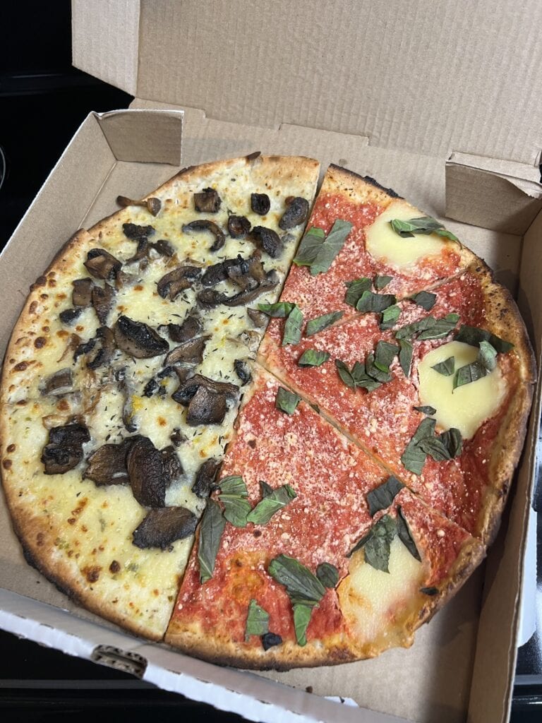 23 Best Things to Do in Deep Cove, BC 2024 17 Pizza that is half margarita and half mushroom in one box from Deep Cove Pizza.