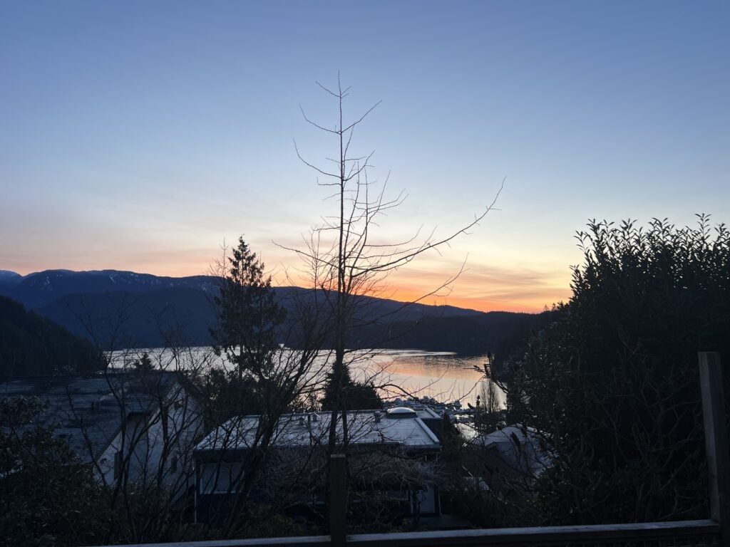 23 Best Things to Do in Deep Cove, BC 2024 20 Orange sunset over Deep Cove and the mountains in the distance from my airbnb.