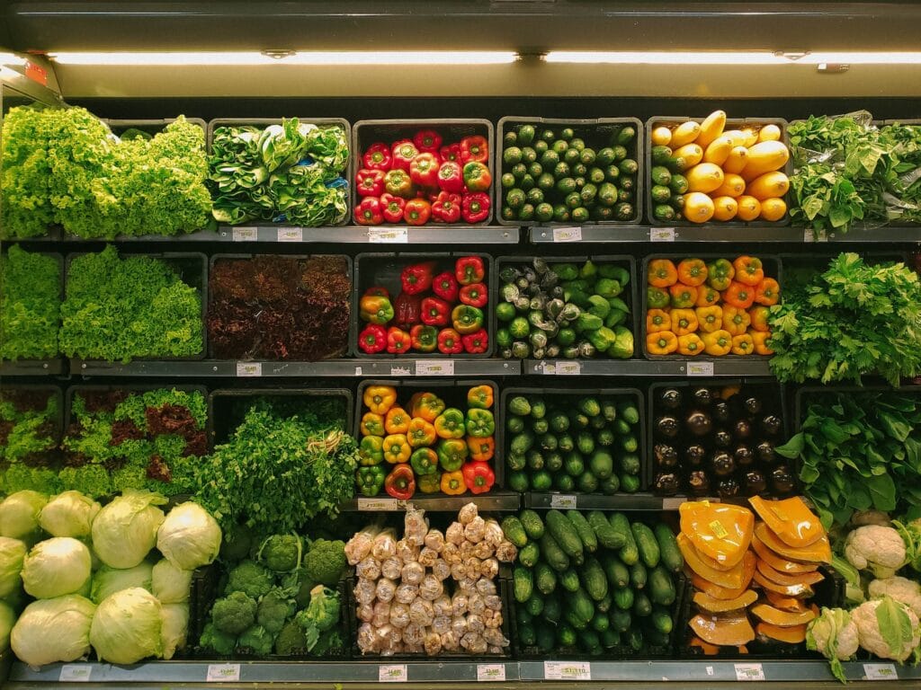 23 Top Pros and Cons of Living in Miami in 2024 4 Different types of vegetables all arranged in shelves in a grocery store. In Miami, groceries and restaurants are often a short walk away!