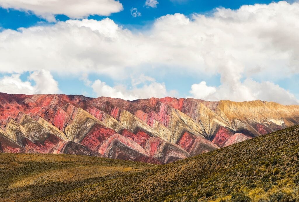 40+ Countries with Working Holiday Visas in 2024 5 brown and gray mountains under white clouds and blue sky during daytime in Argentina