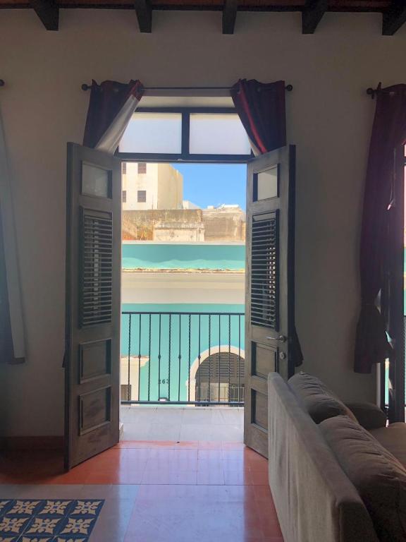 13 Best Hotels in Old San Juan, Puerto Rico 2024 14 Double doors leading to a balcony in one of the rooms in La Terraza de San Juan, a hotel in Old San Juan.
