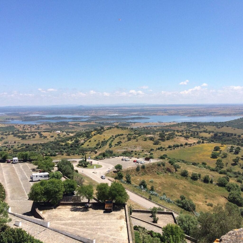 33 Living in Portugal Pros and Cons from an Expat 3 View of the Portugal countryside with views of trees, fields, and a lake